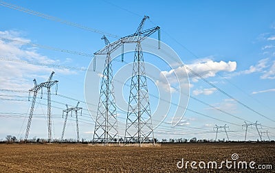 Silhouette High voltage electric towers. High-voltage power lines. Electricity distribution station Stock Photo