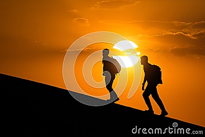 Silhouette of hikers,people side view walking toward successful .Travel and success concept. Editorial Stock Photo