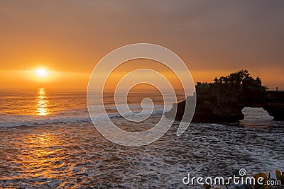 Silhouette of Hindu temple Pura Tanah Lot and sunset Stock Photo