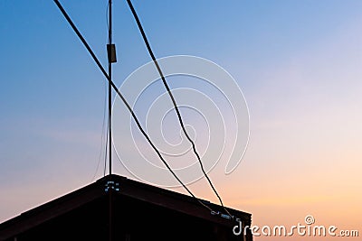 Silhouette house and cable wire Stock Photo