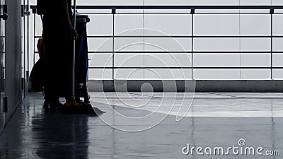 Silhouette of cleaning service people sweeping floor Stock Photo