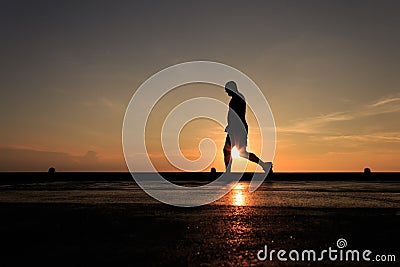 Silhouette Image of man walking on the helideck Stock Photo