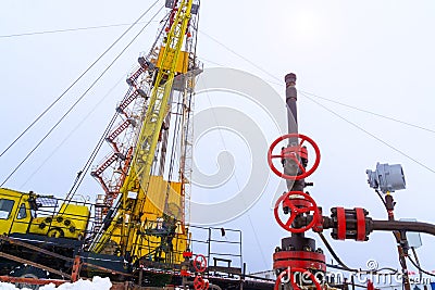 Silhouette image of oil and gas drilling rig in the middle of nowhere with dramatic sky. Onshore land rig in oil and gas industry Stock Photo