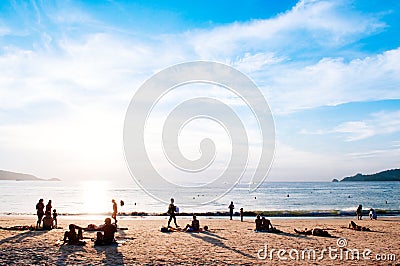 Silhouette image of tourists take sunbathing in evening at Patong beach, Phuket Editorial Stock Photo