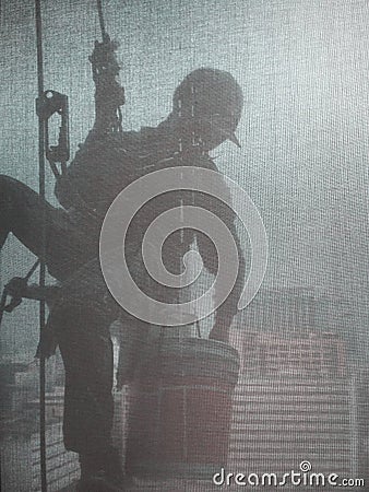 Silhouette images of man cleaning the window office building Stock Photo