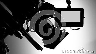 Silhouette images of video camera in tv commercial studio production Stock Photo