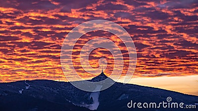 Silhouette of Jested mountain at sunset time with beautyifully illuminated evening sky, Liberec, Czech Republic Stock Photo