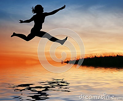 Silhouette jump girl on water Stock Photo