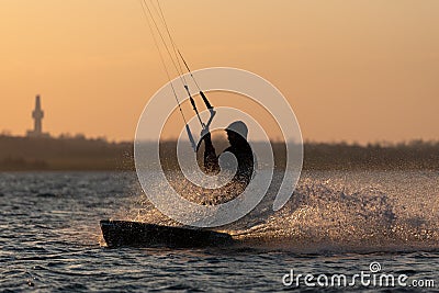 Silhouette of a kitesurfer on the coast of Kiel, Germany at sunset Stock Photo