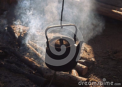 Kettle over an extinct fire Stock Photo