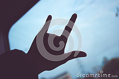 silhouette of Love hand sign at train window, Love travel concept,Vintage filter Stock Photo