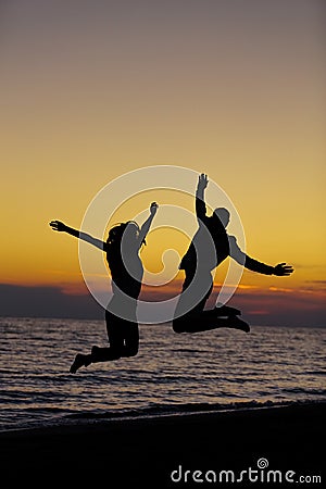 Silhouette of Lovely Couple at the beach Stock Photo