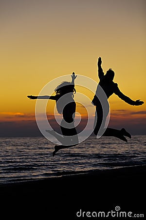 Silhouette of Lovely Couple at the beach Stock Photo