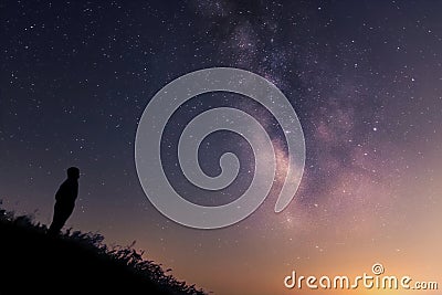 Silhouette of a man against the night sky. Milky way core Stock Photo