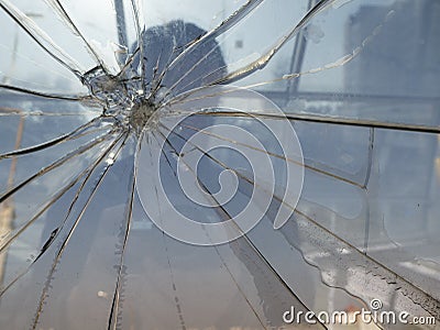 Silhouette of a man behind broken glass Stock Photo