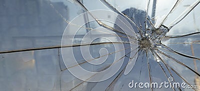 Silhouette of a man behind broken glass Stock Photo