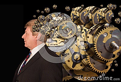 Silhouette of a man with a brain made up of gears or cogs machine parts workings Stock Photo