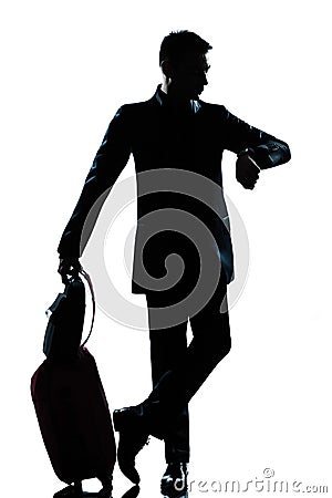 Silhouette man business traveler checking the time Stock Photo