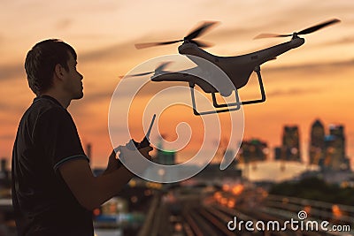 Silhouette of a man controlling flying drone. 3D rendered illustion of drone. Cartoon Illustration