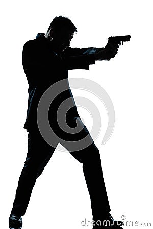 Silhouette man full length shooting with gun Stock Photo