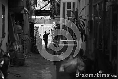 Silhouette of the man at the gate of the courtyard at home Stock Photo