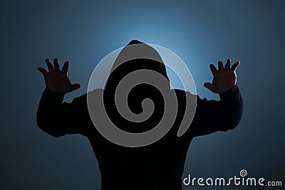 a silhouette of a man with hoodie Stock Photo