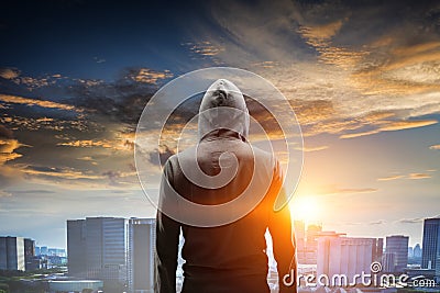 Silhouette of man in hoody Stock Photo