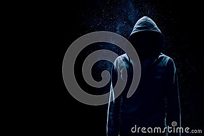 Silhouette of man in hoody Stock Photo