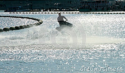 Silhouette of a man on the jet ski in the sea with water splashes at Koh Larn island,Pattaya, Chonburi, Thailand. Editorial Stock Photo