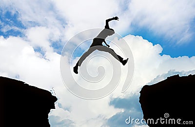 Silhouette of man jumping Stock Photo