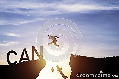Silhouette man jumping from can`t cliff to can cliff , Change Mindset concept Stock Photo