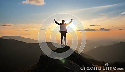 silhouette of a man on top who has reached the top of the mountain Stock Photo