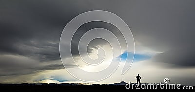 Silhouette of man watching huge storm and clouds in Iceland Stock Photo