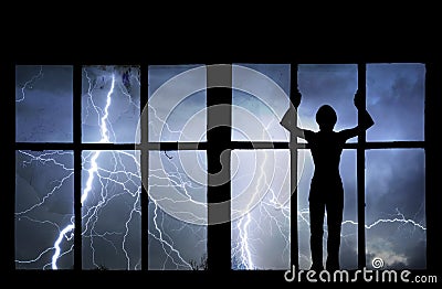 Silhouette of man watching lightning, thunder, rain and storm Stock Photo