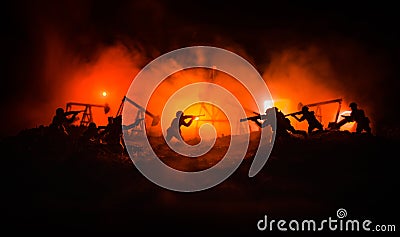 Silhouette of military soldier or officer with weapons. shot, holding gun, colorful sky, background. Oil war and military concept. Stock Photo