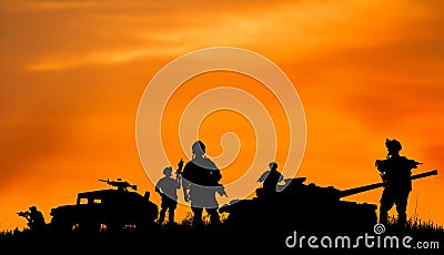 Silhouette of military soldier or officer with weapons at sunset Stock Photo