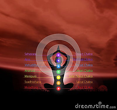 Silhouette of a monk meditating in a lotus position Stock Photo