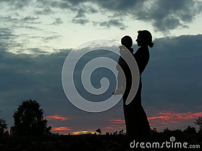 Silhouette mother with baby Stock Photo