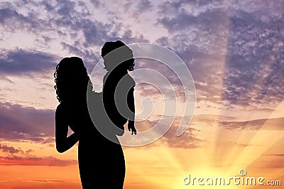 Silhouette mother with a baby Stock Photo