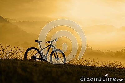 Silhouette Mountain bike at sunset Stock Photo