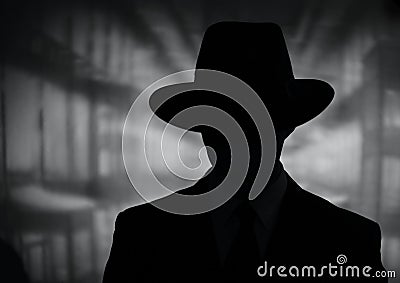Silhouette of a mysterious man in a hat Stock Photo