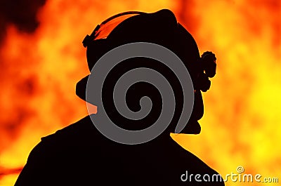 Silhouette one fireman officer front fire flames Stock Photo