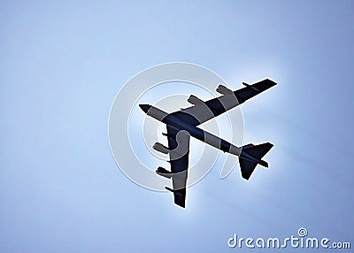 High flying United States Air Force Boeing B-52 Stratofortress in silhouette. Stock Photo