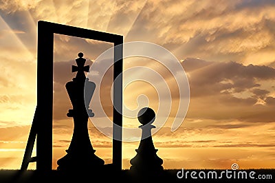 Silhouette of a pawn, sees himself in the reflection of the mirror queen Stock Photo