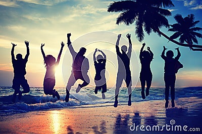 Silhouette People Jumping with Excitement on a Beach Stock Photo
