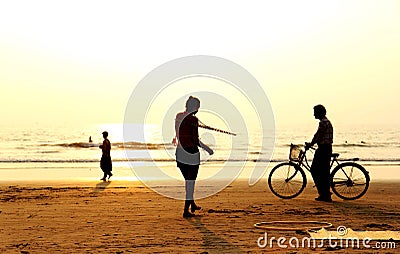 Silhouette of people during sunset in Arambol Beach, Goa India. Editorial Stock Photo