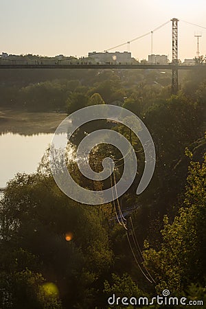 Silhouette of people traveling across bridge Stock Photo