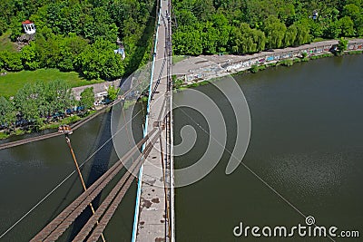 Silhouette of people traveling across bridge Stock Photo