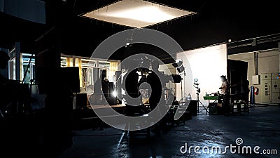 Silhouette of people working in big production studio Stock Photo