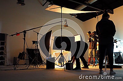 Silhouette of people working in production studio. Editorial Stock Photo